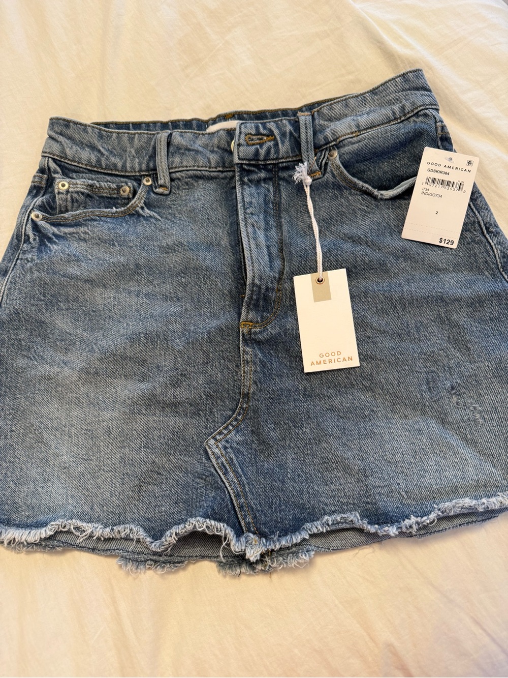 Good American Light Wash Denim Frayed Hem Mini Skirt